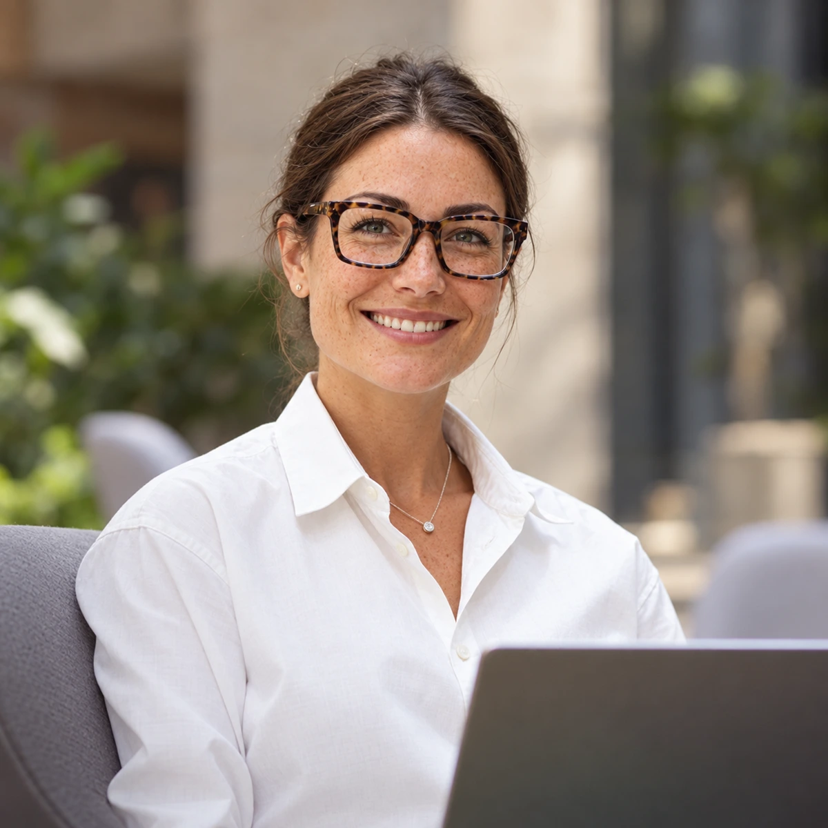 AI-generated illustration: A woman wearing glasses working at a laptop